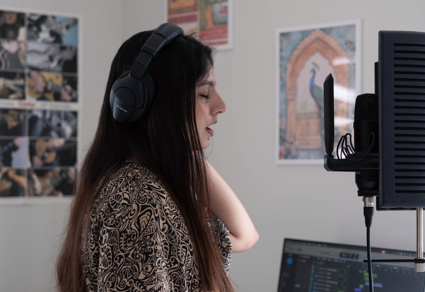 Riha recording vocals in her home studio